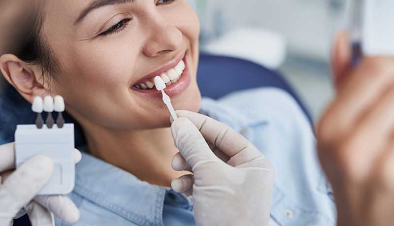 The patient is getting the Dental Bonding Service from the doctor in Palm Desert, CA.